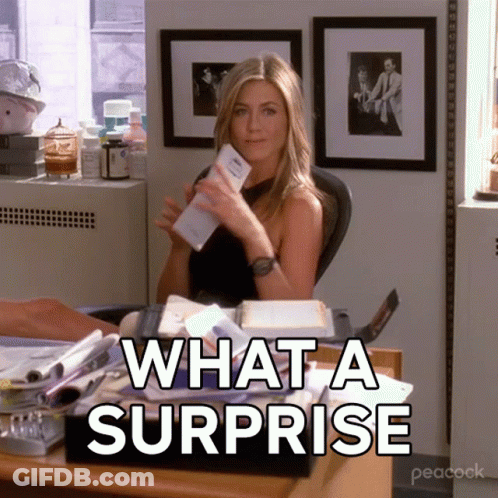 Woman At Desk What A Surprise GIF