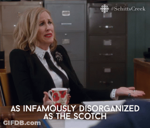 Woman At Desk With Coffee As Infamously Disorganized As The Scotch GIF