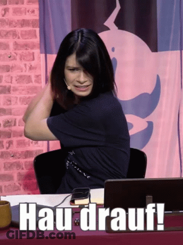 Woman At Desk With Hau-Drauf Sign GIF