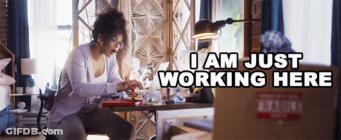 Woman At Desk With Laptop Saying I Am Just Working Here GIF