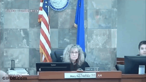 Woman At Desk With Mary Sign GIF