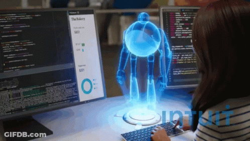 Woman At Desk With Monitor Saying The Bakery GIF