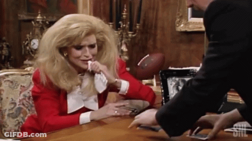 Woman At Desk With SNL Logo GIF