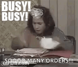 Woman At Desk With Stack Of Papers GIF