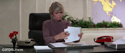 Woman At Desk With World Map GIF