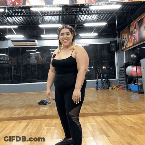 Woman At Gym Mirror With Music Zone Sign GIF