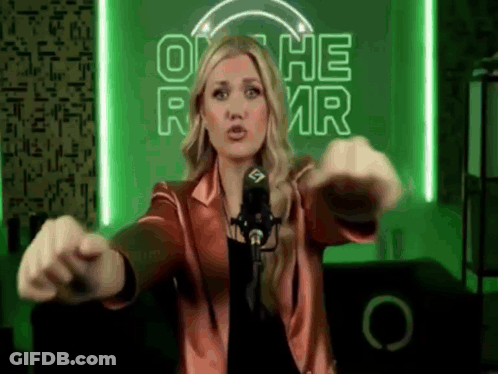 Woman At Microphone In Front Of On The RMR Neon Sign GIF