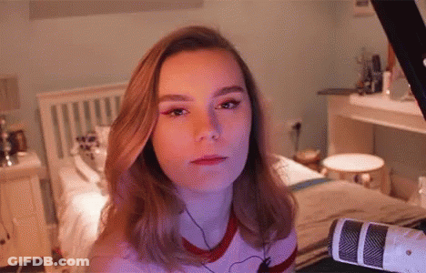Woman At Microphone Looking At Camera GIF
