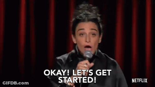 Woman At Microphone Saying Okay Let's Get Started GIF