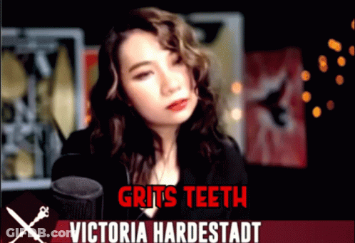 Woman At Microphone With Gritted Teeth Victoria Hardestadt GIF