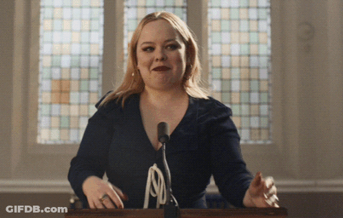 Woman At Podium Microphone Stained Glass Window GIF