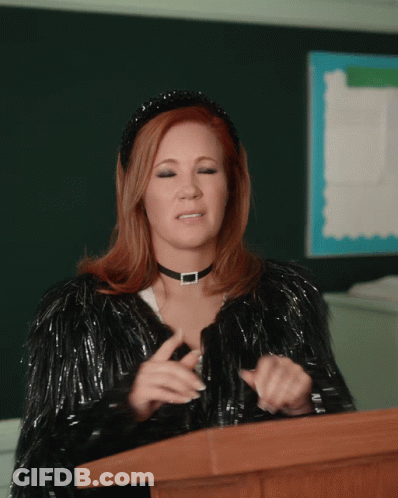 Woman At Podium With Choker And Fur Coat GIF