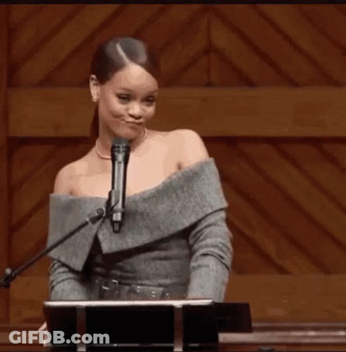 Woman At Podium With Microphone Making Funny Face GIF