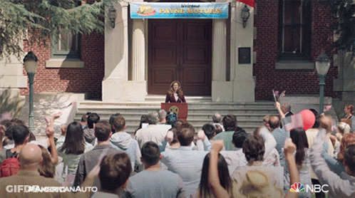 Woman At Podium With Payne Motors Sign GIF