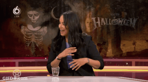 Woman At Screen Saying Happy Halloween GIF