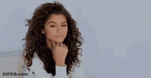 Woman At Table And Man On Couch GIF