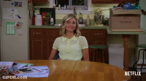 Woman At Table In Kitchen With Item Handling Box GIF