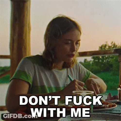 Woman At Table Saying Don't Fuck With Me GIF