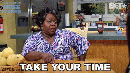 Woman At Table Saying Take Your Time GIF
