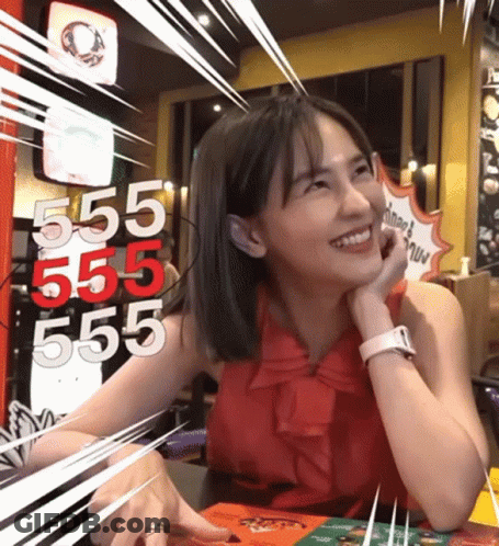 Woman At Table With 555 555 555 On Wall GIF