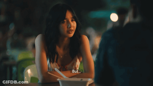 Woman At Table With Bowl Saying Defense GIF