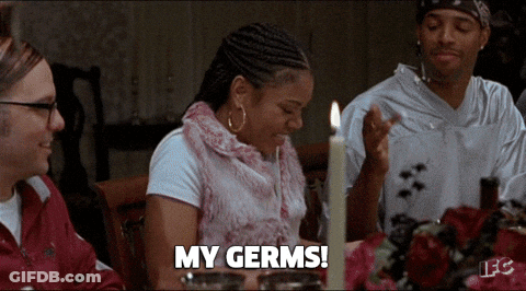 Woman At Table With Candle Says My Germs GIF