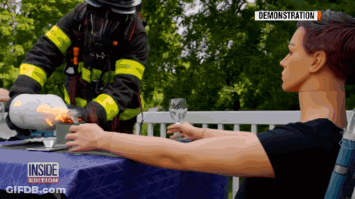 Woman At Table With Fireman Inside Edition GIF