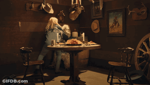 Woman At Table With Food And Candles GIF