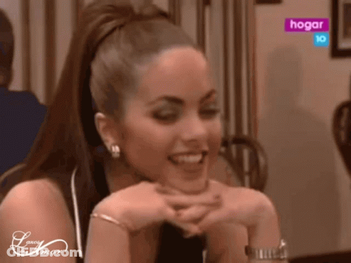 Woman At Table With Hogar Sign GIF