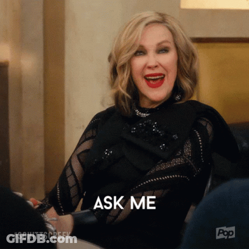 Woman At Table With Mouth Open And Ask Me Behind Her GIF