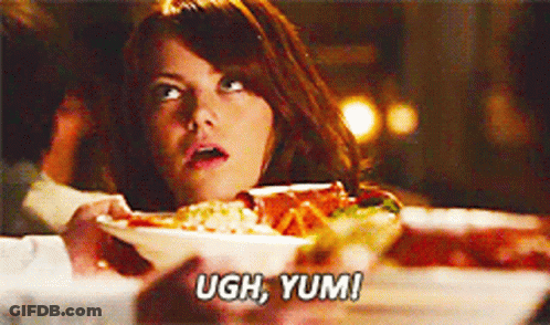 Woman At Table With Plate Of Food Saying Ugh Yum GIF