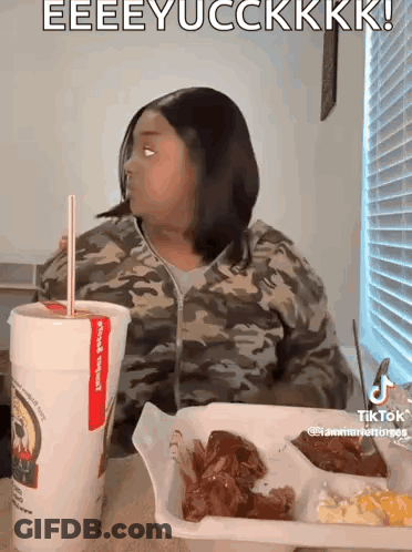 Woman At Table With Tray Of Food And Drink GIF