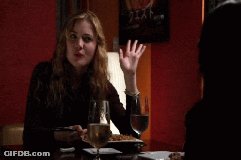 Woman At Table With Wine And Food GIF