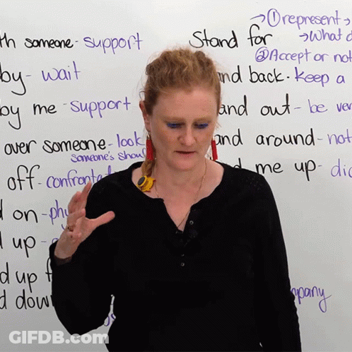 Woman Before White Board Saying Stand For GIF