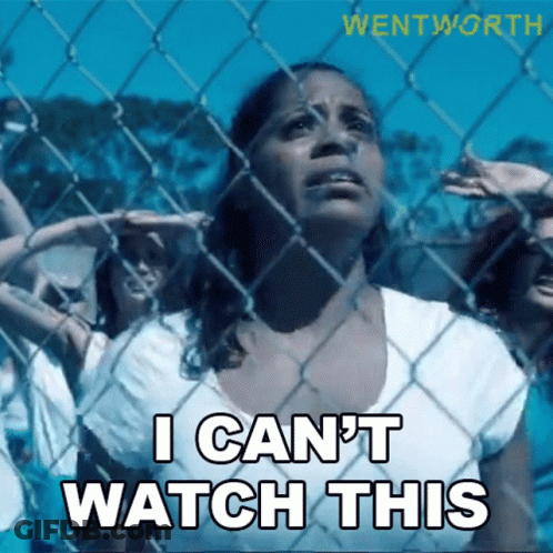Woman Behind Chain Link Fence Saying I Can't Watch This GIF