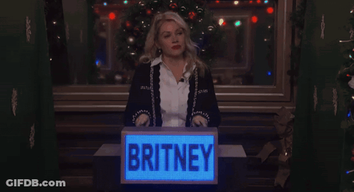 Woman Behind Podium Saying Britney GIF
