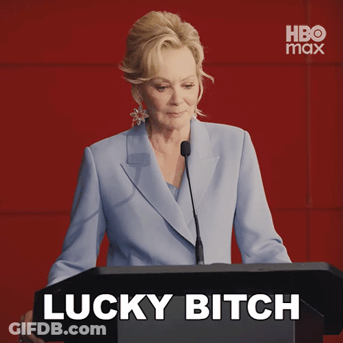 Woman Behind Podium Saying Lucky Bitch GIF