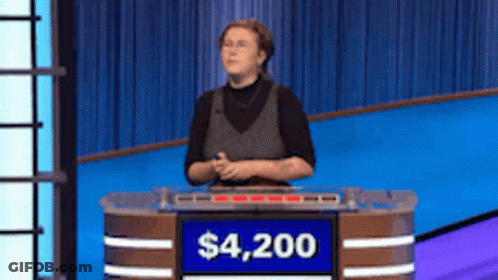 Woman Behind Podium With Sign Saying $4,200 GIF