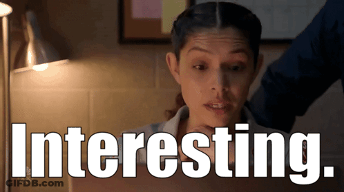 Woman Behind Sign Saying Interesting GIF