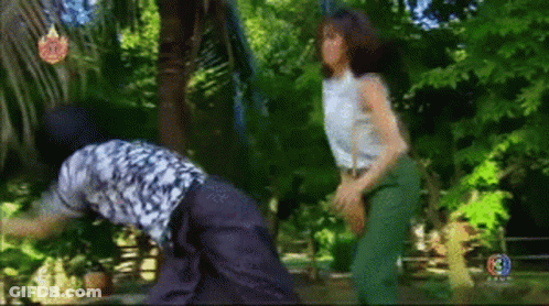 Woman Beside Man In Jungle GIF