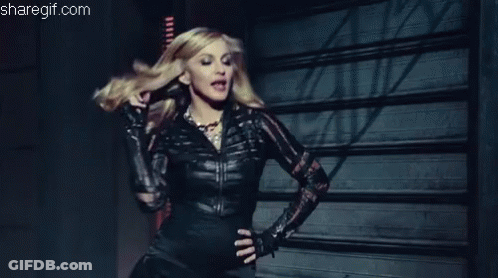 Woman Black Leather Jacket And Gloves Garage Door GIF