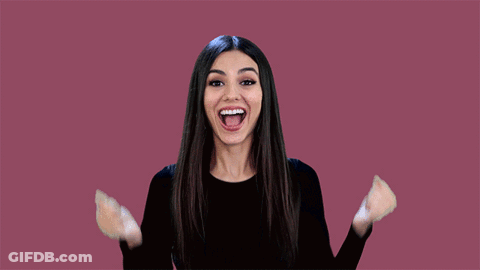 Woman Black Shirt Arms Up Smiling GIF