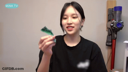 Woman Black Shirt Holding Toy Mina TV Vacuum GIF