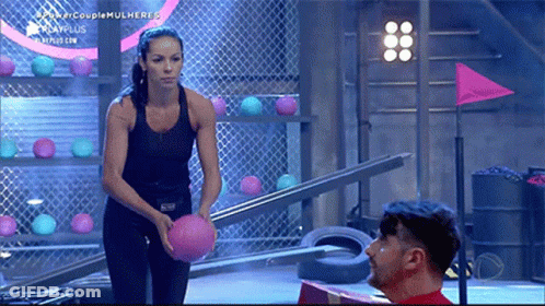 Woman Black Top Holding Pink Ball Beside Man GIF