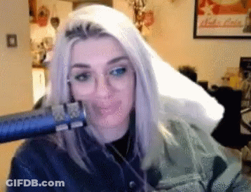 Woman Blow Drying Hair In Front Of Nuka Cola Poster GIF