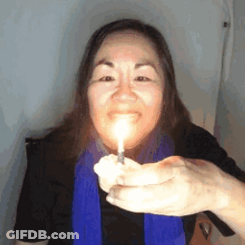 Woman Blowing Birthday Candle On Cupcake GIF