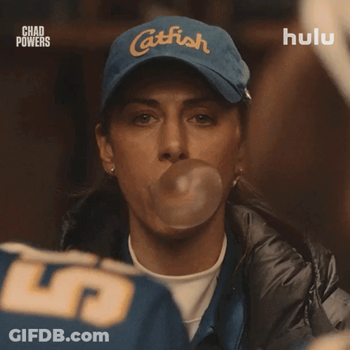 Woman Blowing Bubble With Catfish Hat GIF