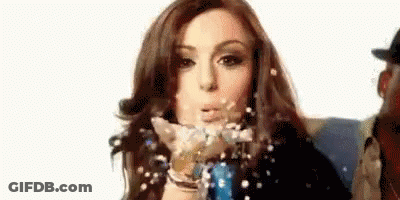 Woman Blowing Confetti GIF