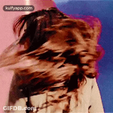 Woman Blowing Hair In Wind GIF