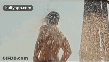 Woman Blowing Kiss In Front Of Water GIF